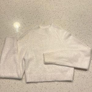 Has been only dry cleaned so in amazing shape. It is crop.